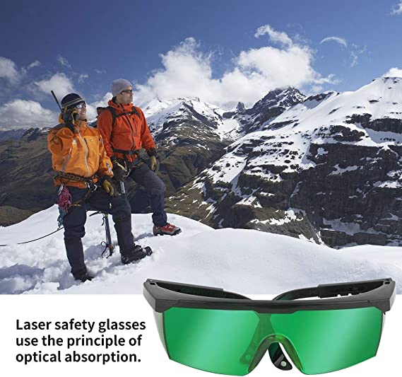 two men stand on the snowy mountain wearing comgrow laser safety glasses that use the principle of optical absorption